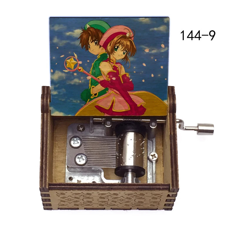 A musical tone box featuring anime characters, including a girl with green hair and a boy, packaged in a wooden box.