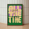 A framed canvas art print featuring the text ALL GOD IS THE GOOD TIME in yellow and purple lettering on a green background.
