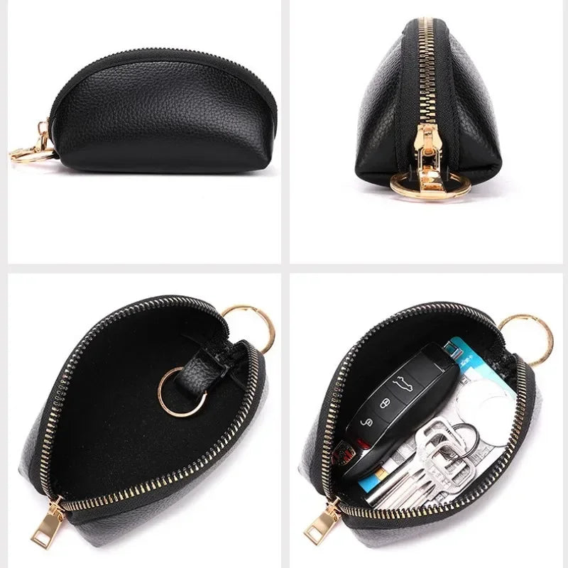 Black leather key organizer wallet with a gold zipper closure and attached keys.