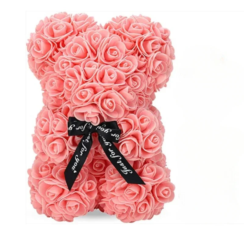 A pink rose-themed teddy bear made of fabric for special occasions