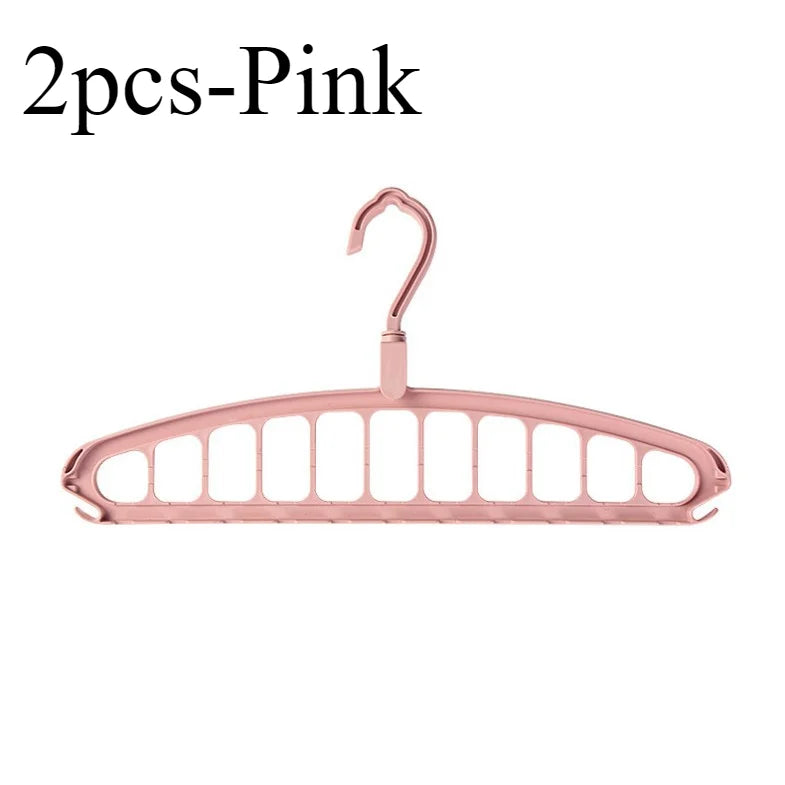 A pink foldable multi-hole space-saving laundry drying rack.