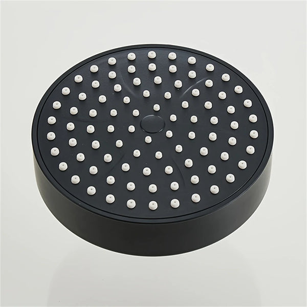 A black bathroom faucet replacement with multiple small nozzles visible on the top surface.