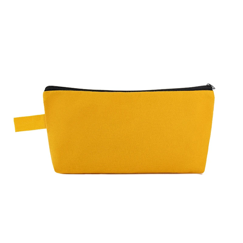 A bright yellow zippered pouch used for storing cosmetics or stationery.