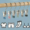 Stainless steel clothespin set with various colored grips for laundry and organization
