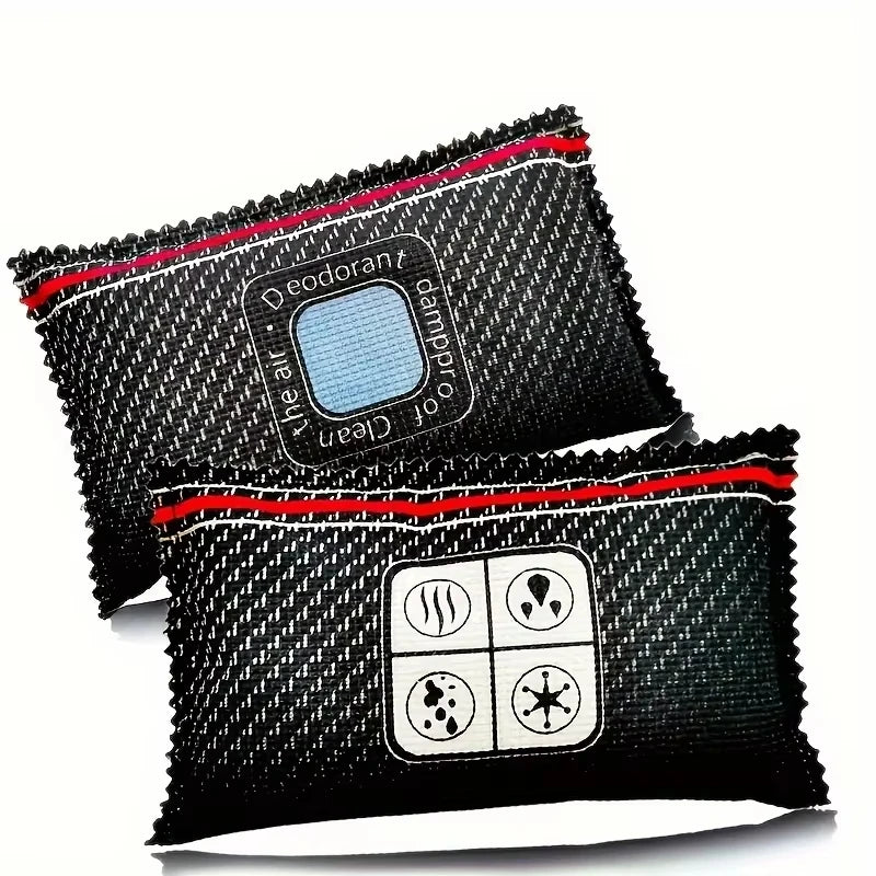 A pair of black reusable silica gel dehumidifier bags with a textured surface and a red trim.