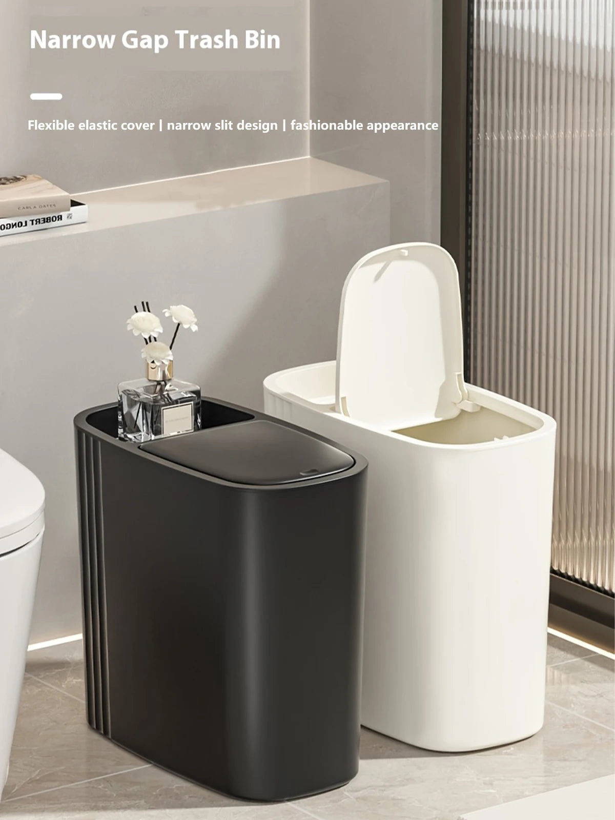 A black narrow gap trash bin with a press lid is shown next to a white version and a bathroom counter.