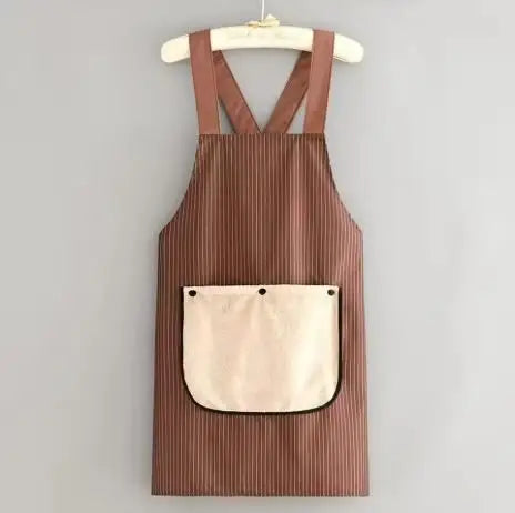 A brown striped waterproof sleeveless kitchen apron with a removable beige hand towel hanging on a wooden hanger.