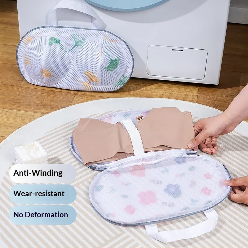 A beige mesh laundry bag for delicates and lingerie protection is shown on a white surface.