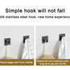 A stainless steel hook hanging on a white wall, demonstrating a simple hook that will not fall.