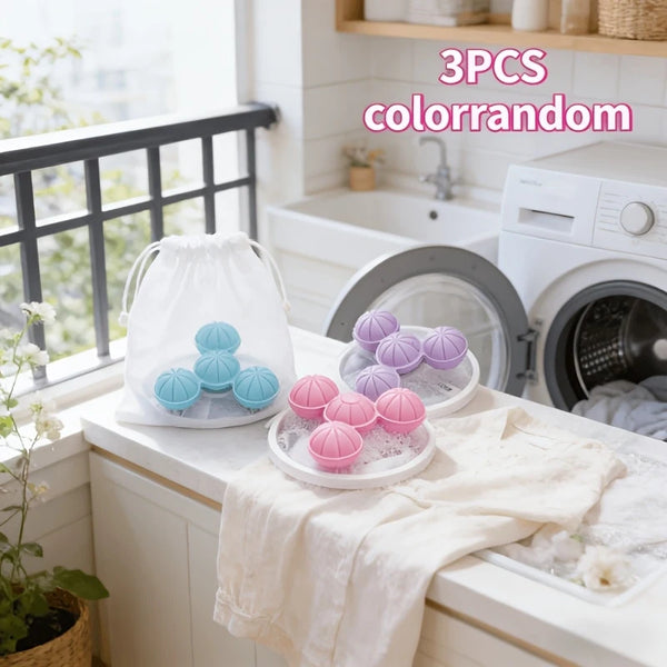 Three silicone colorandom floating laundry filter bags displayed on a white countertop.