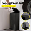 A black pop-up press lid trash can is shown being used on a toilet tank.