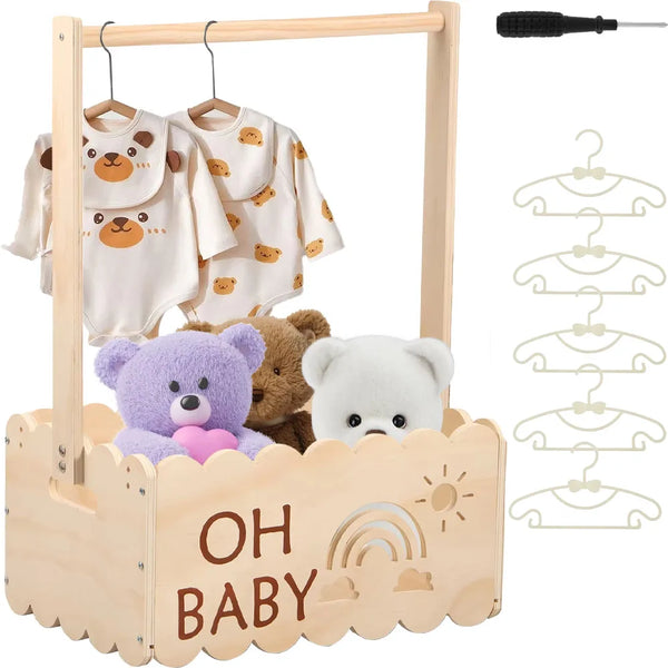 Wooden storage basket with a handle holding baby-themed clothing and a small black tool