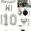 Un set de globos de foil plateados y negros con letras, números y forma de corazón para decoración de cumpleaños.