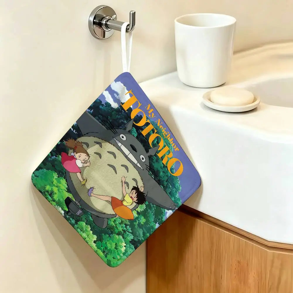 A cute Totoro cartoon-themed hanging hand wiping towel is displayed on a wall.