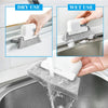 A white 2-in-1 groove and track cleaning brush is shown being used for both dry and wet cleaning of a kitchen sink.