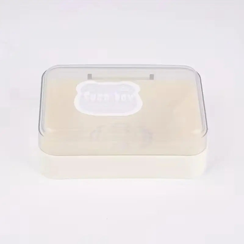 A clear plastic box containing a bar of soap for draining or cleaning purposes.