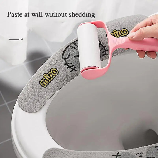 A hand is applying paste to a white toilet seat cushion cover, demonstrating the product's ability to apply paste without she