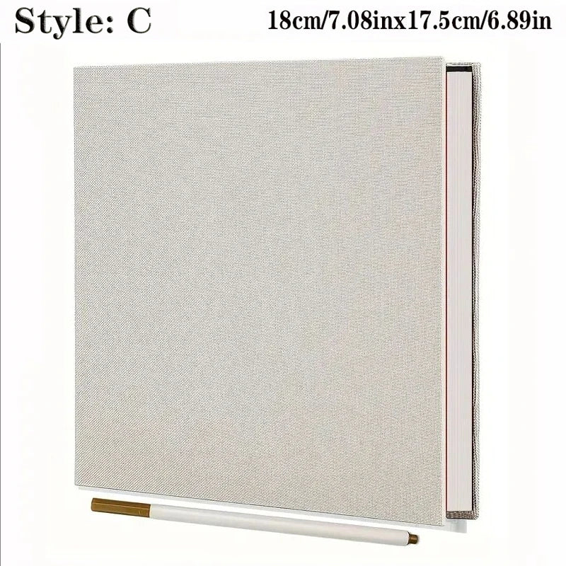 Quadern-Fotobuch-Umschlag aus Leinen in hellem Beige mit silberner Kante.