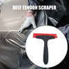 A hand wearing a glove is using a beef tendon scraper to clean a surface.