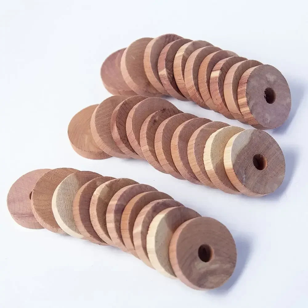 A collection of round wooden blocks stacked in a spiral pattern for pest deterrents.