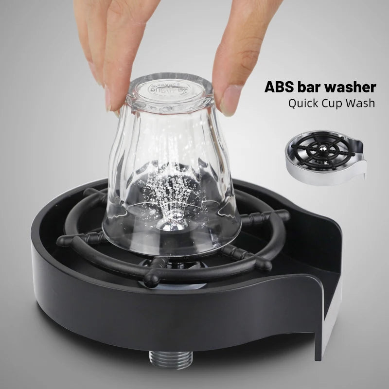 A hand is placing an ABS bar washer into a black dish for quick cup washing.