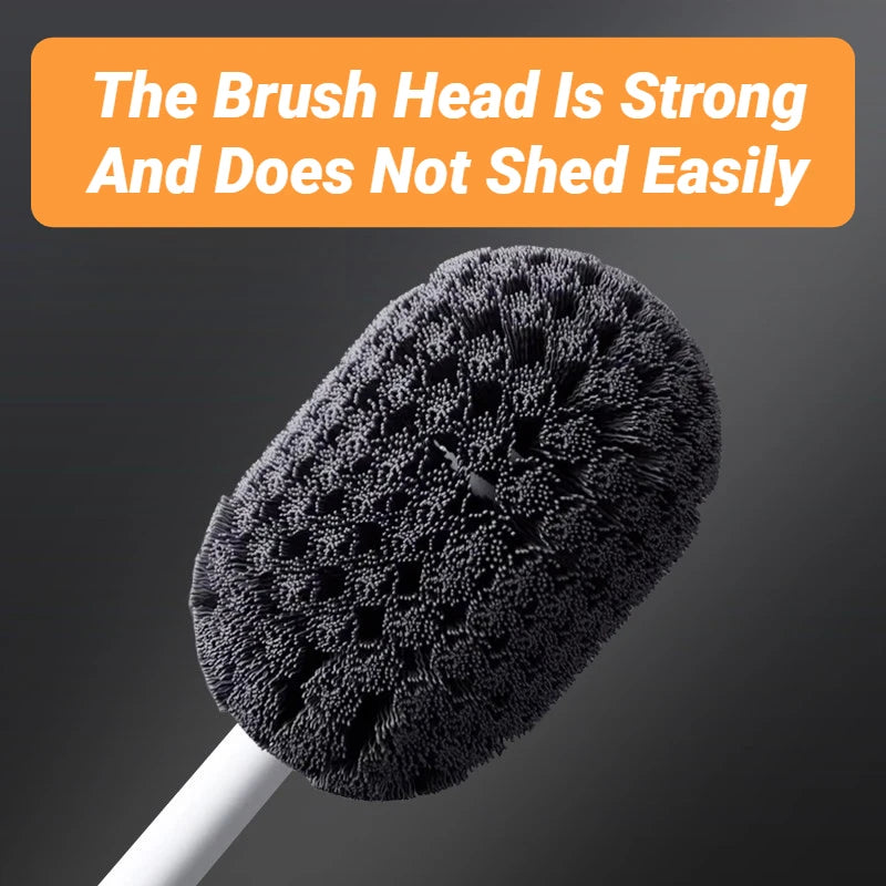 A close-up view of a black toilet brush head with dense bristles on a white handle.