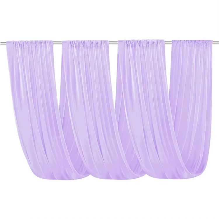 A set of sheer lilac chiffon ceiling draping fabric panels hanging horizontally.