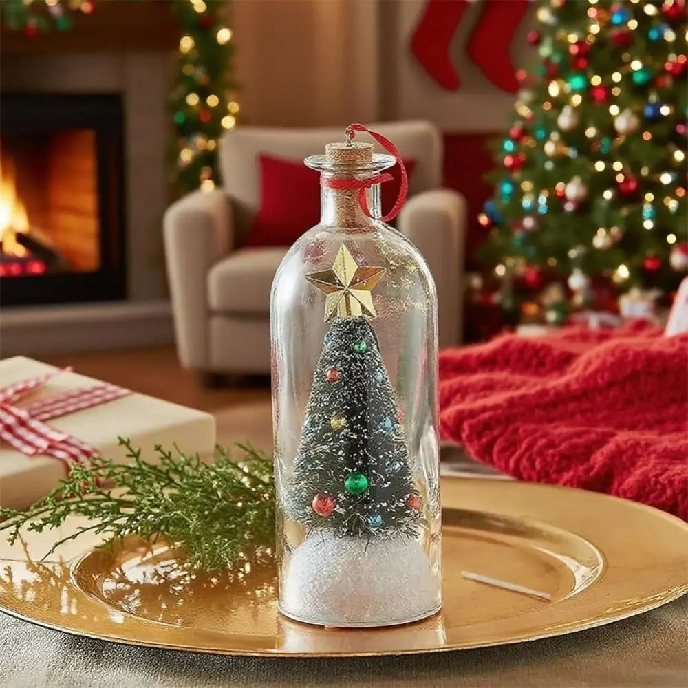 A glass bottle shaped like a Christmas tree filled with glitter sits on a gold plate in a festive holiday setting.