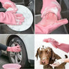 Pink silicone dishwashing gloves cleaning a car tire and a dog's face
