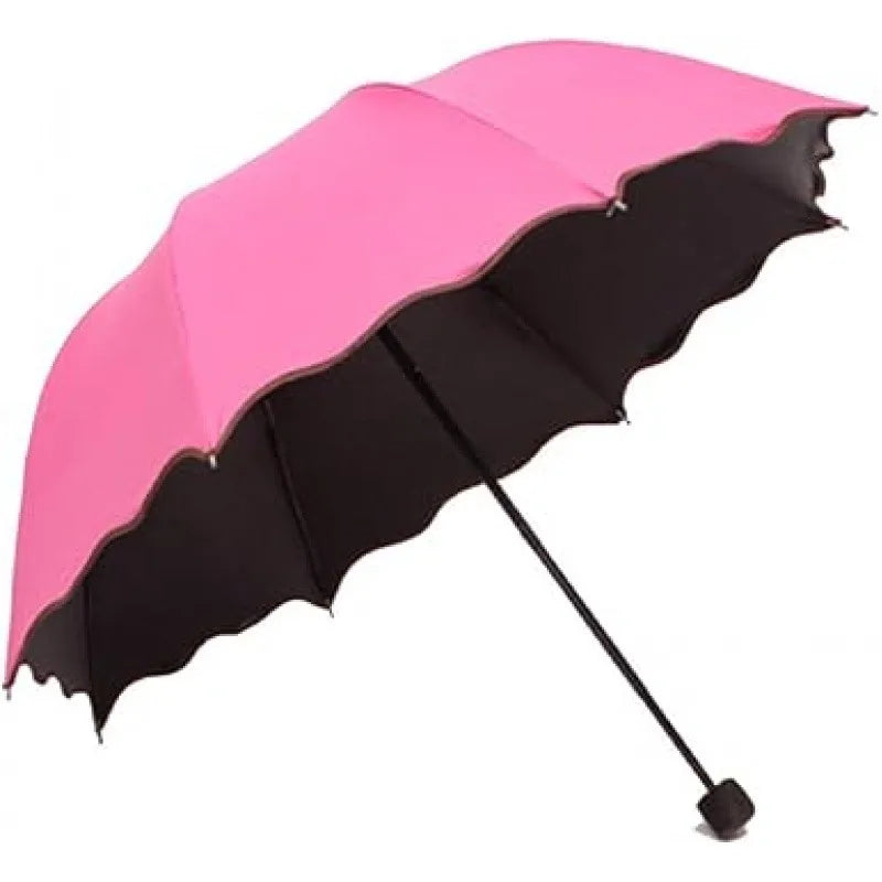 A pink and black reversible umbrella with sun protection.