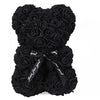 A bouquet of black artificial roses tied together like a teddy bear for special occasions