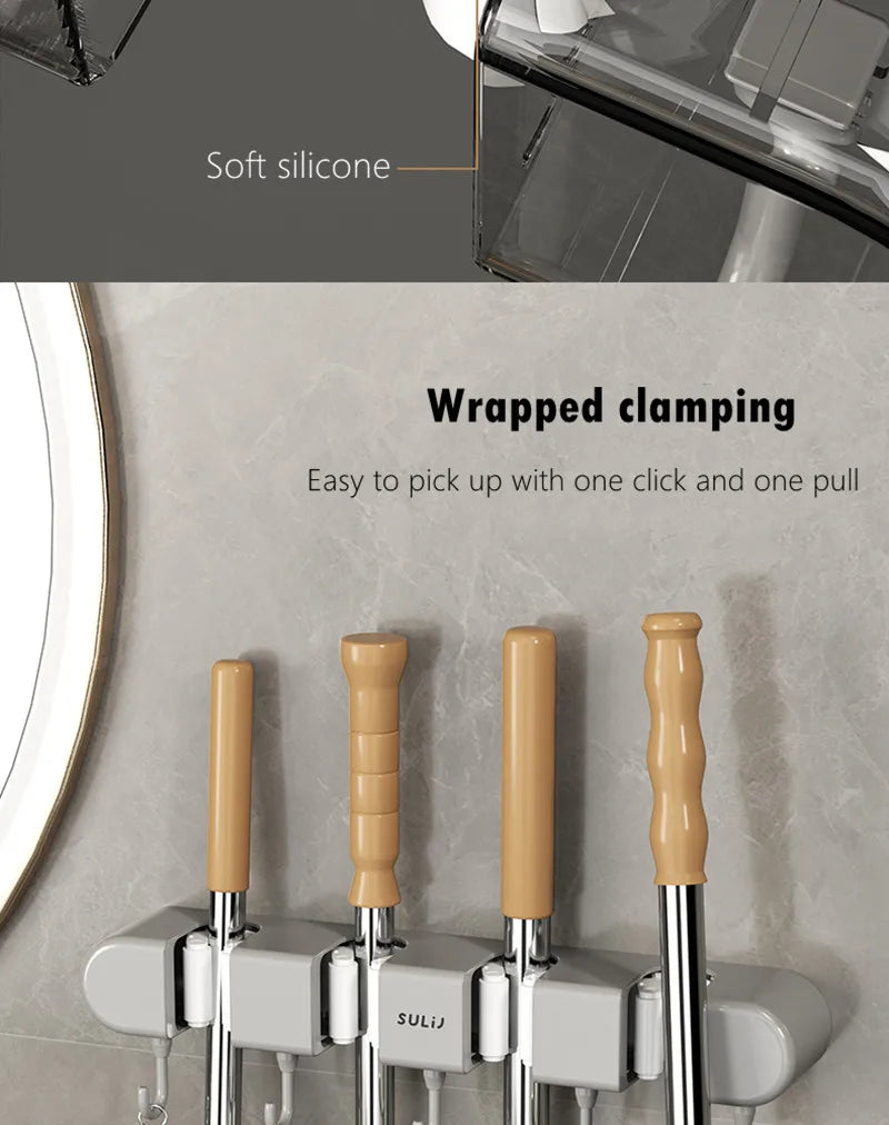 Wall mounted broom holder with soft silicone grips for easy gripping