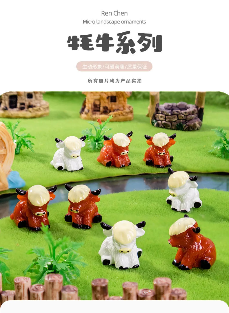 A collection of resin highland cow figurines in various colors and poses displayed on a green landscape setting.