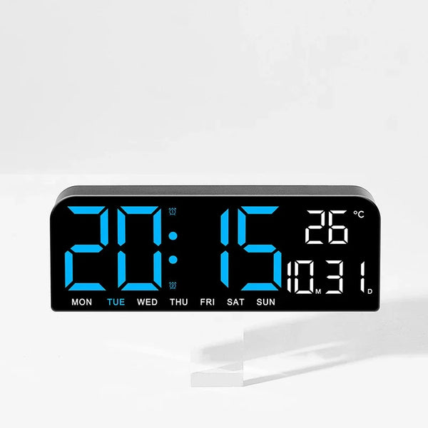 A digital wall clock displaying 20:15 and a temperature of 26 degrees Celsius.