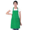 A woman wearing a bright green oil-proof cooking apron with pockets.