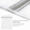 Close-up view of a white mesh laundry bag with a silver zipper, showing internal curling and ripstop fabric structure.