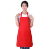 A woman wearing a red oil-proof cooking apron with pockets.