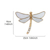 Golden dragonfly mirror wall decor featuring translucent wings and a gold body.