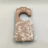 A set of wooden closet dividers marked 6-9 months for clothes organization, packaged in clear plastic.