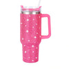 Taza aislada de acero inoxidable con pedrería rosa y tapa transparente.