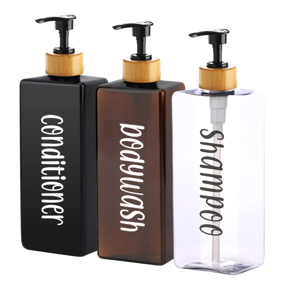 Three black and amber refillable pump bottles for body wash and shampoo