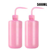 A pair of pink 500ml squeeze bottles with measurement marks for tattoo solutions.