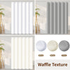 Three variations of waffle texture shower curtains in white beige and gray with weighted hems.