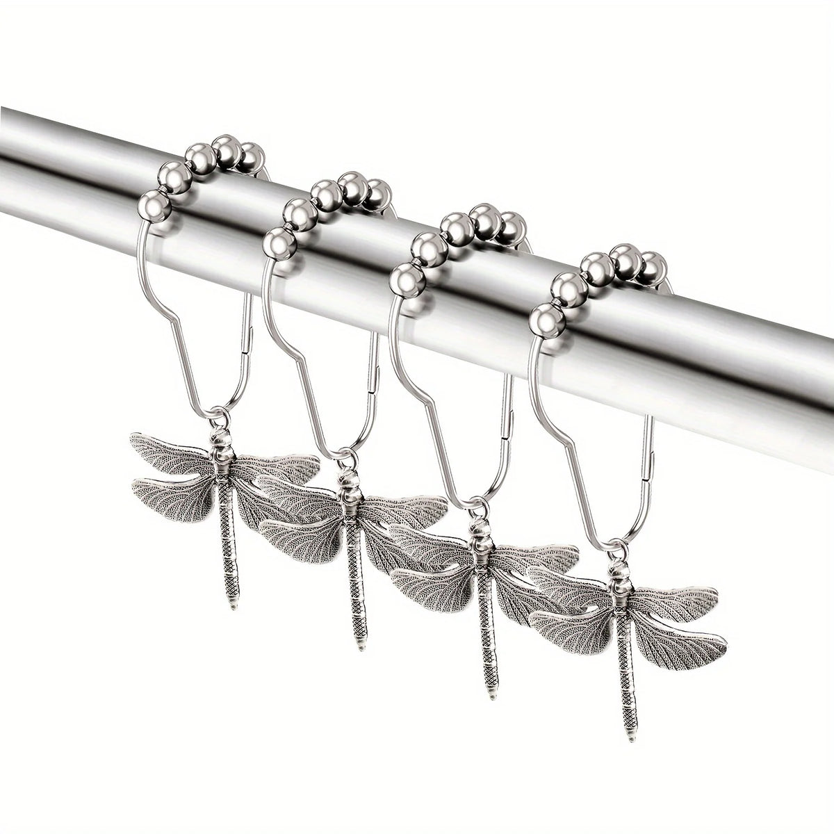 Silver dragonfly shower curtain hooks set hanging from a metal rod