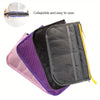 A foldable cosmetic organizer pouch shown in purple, pink, and black fabric.