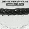 Close-up of water dripping from a dark microfiber cloth into a pool of water.