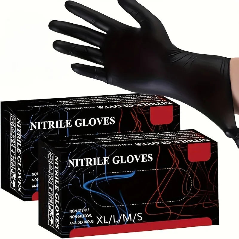 A hand wearing a black nitrile glove is shown next to a box of nitrile gloves.