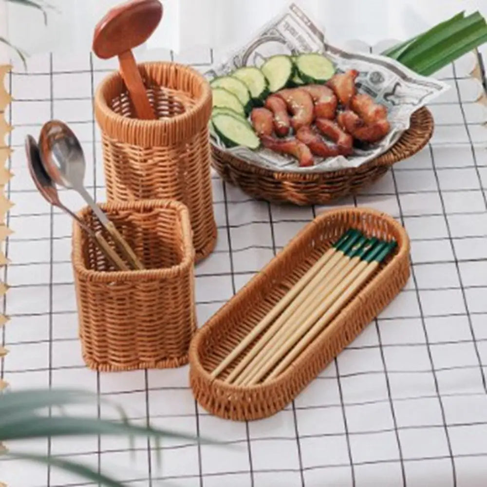 Handwoven rattan serving baskets holding chopsticks and sliced cucumbers on a white checkered cloth.