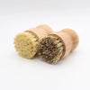 A set of two bamboo dish scrub brushes with sisal bristles, showing light yellow and dark brown fibers.