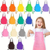 A collection of thirty colorful non-woven craft aprons in various shades of red, orange, yellow, green, blue, and purple, dis